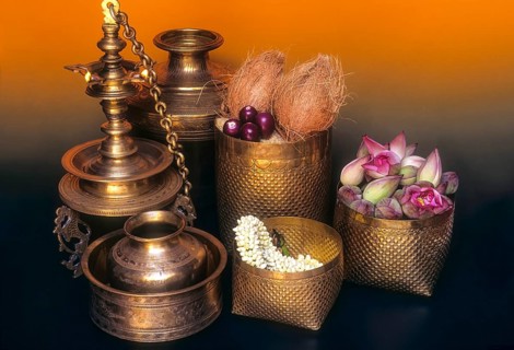 Sacred brass oil lamps and replications of traditionally woven palm-leaf baskets in a Nattukottai Chettiar house
