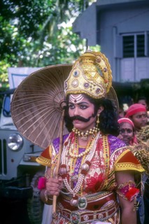 Maveli or king Mahabali model dressing with ornaments and umbrella for onam festival in Kerala