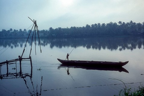 Chinese fishing net and a fishing boat backwaters of Kodungallur