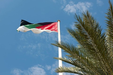 Flagpole with flag of Jordan