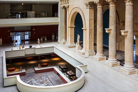 Visitors look at a Roman mosaic from Apamea