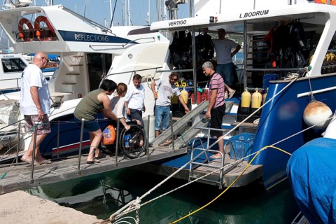 Disabled divers on board diving ship