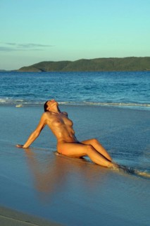 Woman at nudist at the sea