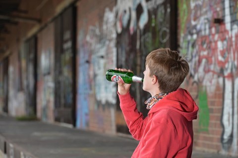 Youth drinks beer