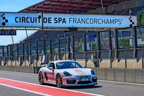 Racing car Sports car Porsche Cayman GT4 drives through pit lane Pit Lane of race track