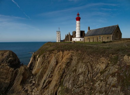 The lighthouse Phare de Saint-Mathieu with the chapel Notre Dame de Grace of Our Lady of Grace in the department of Finistere at the western tip of Brittany