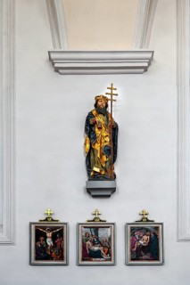 Figure of the saint and three stations of the cross