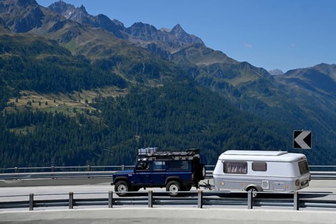 Off-road vehicle with caravan Gotthard Pass