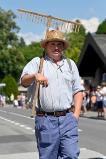 Parade man with hay rake