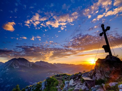 Summit cross of the Brettgabel at sunset