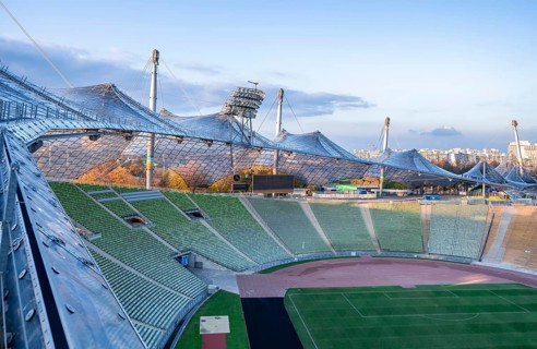 View over Olympic Stadium with rows of seats and football pitch