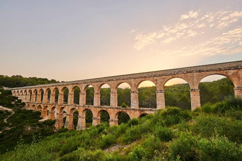 Old roman aqueduct at sunrise