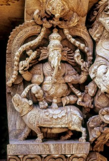 Lord Ganesh Ganpati riding on Rat Mouse Mushika. 17th century wooden carvings in Meenakashi Sundareswarer temple's chariot at Madurai