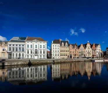 Travel Belgium medieval european city town background with canal. Koperlei street