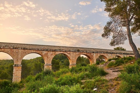 Old roman aqueduct at sunrise