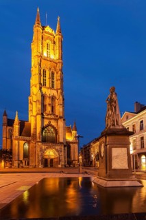 Monument to Jan Frans Willems and Saint Bavo Cathedral in the evening. Sint-Baafsplein
