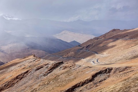 Road in Himalayas in clouds near Tanglang la Pass