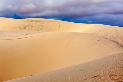 White sand dunes before storm