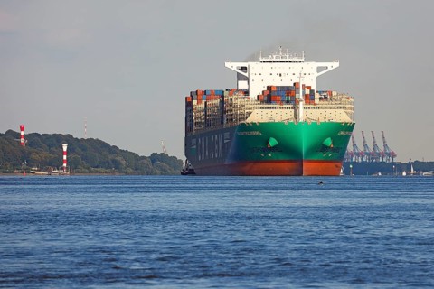 Container ship CMA CGM TROCADERO powered by liquefied natural gas LNG leaves the port of Hamburg on the river Elbe