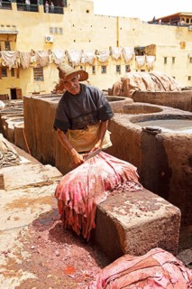 Workers scraping the flesh from the skin