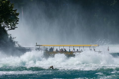 Tourist boat at the jetty of the Aussichtfelsen at the Rhine Falls