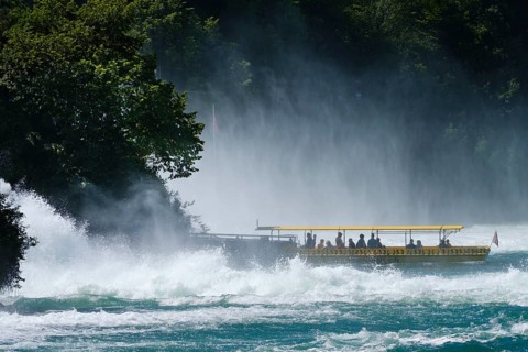 Tourist boat at the jetty of the Aussichtfelsen at the Rhine Falls