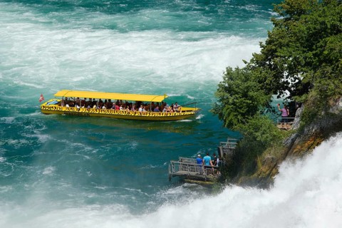 Tourist boat at the jetty of the viewing rock in the Rhine Falls