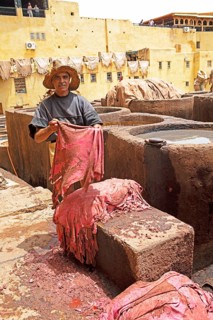 Workers scraping the flesh from the skin