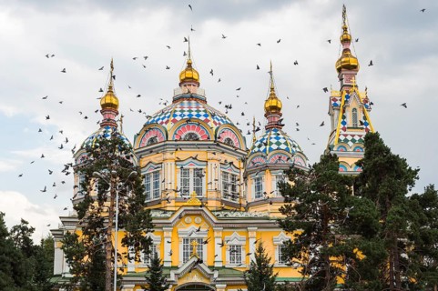 Doves flying over the Ascension Cathedral or Zenkov Cathedral