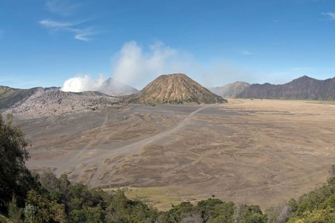 View across plain towards volcanoes