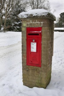 Royal Mail letterbox in the snow