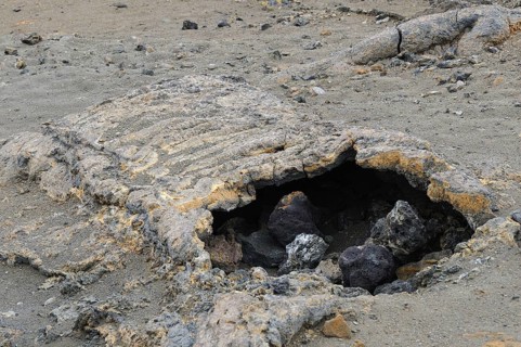 Lava tube formed when the outer layer of the lava flow cools and solidifies