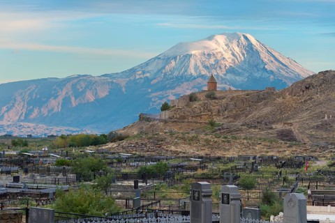 Cemetery of the village Khor Virap with the monastery and Mount Ararat behind