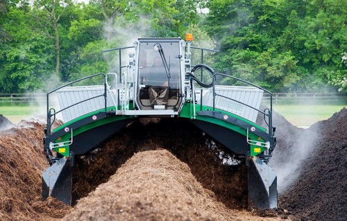 Komptech self-propelled compost turner turning rotting bedding manure