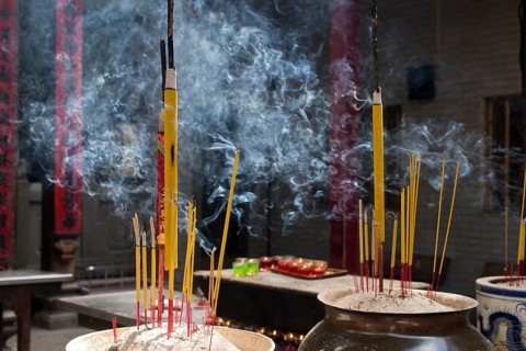 Incense sticks burning on incense pot