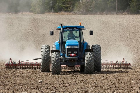 New Holland 8770 tractor with harrows