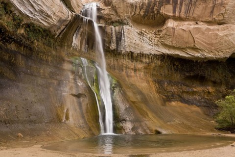 Waterfall cascading over navajo sandstone