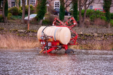 Lely field sprayer in flood water