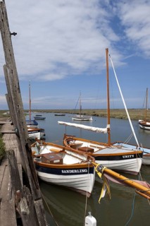 Moored sailboats in coastal creek
