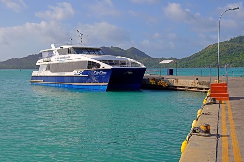 Catamaran ferry of the operator Cat Cocos in the harbour of Praslin Island