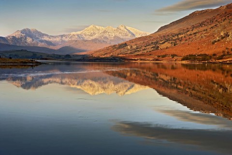 View across the lake towards the mountain at sunrise