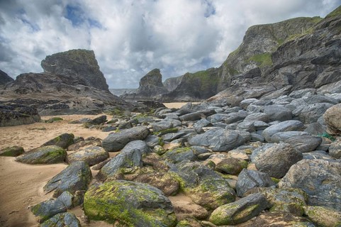 View of beach with slate cliffs