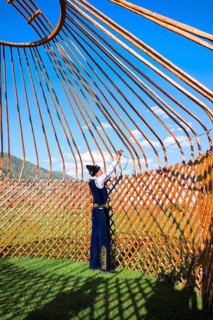 Kazakh men building a yurt