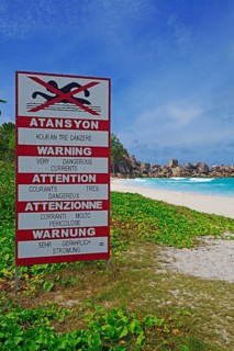 Sign with warnings in different languages about currents