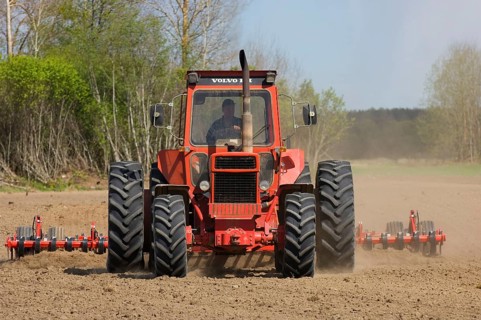 Volvo tractor pulling harrows