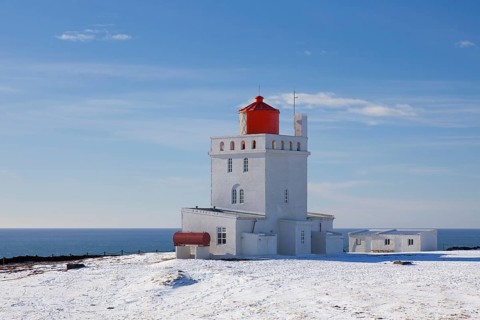 Dyrholaey lighthouse near Vik i Myrdal on the central south coast of Iceland in the snow in winter