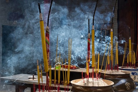Incense sticks burning on incense pot