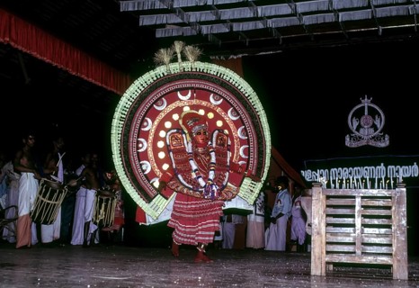 Theyyam or Teyyam ritual dance performing in Kerala Kalamandalam at Cheruthuruthy