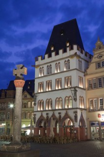 Market cross and restaurant illuminated at night
