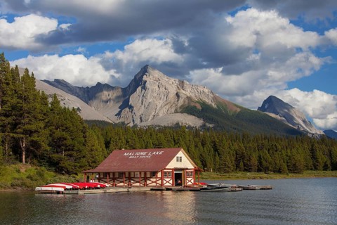 Boathouse with canoes at Maligne Lake